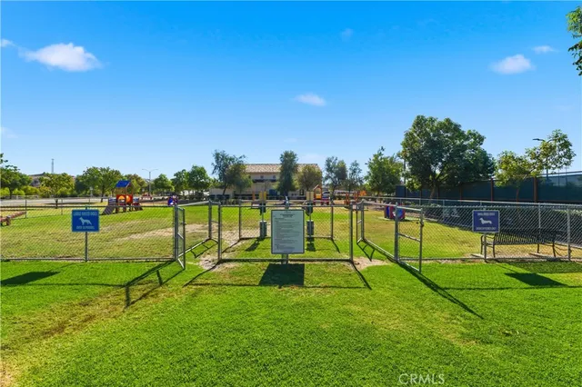 a view of a park with swings and slides