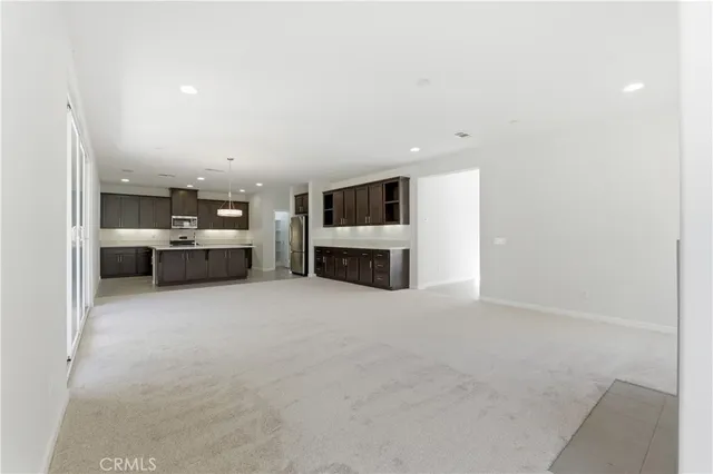a view of a livingroom with furniture and a fireplace