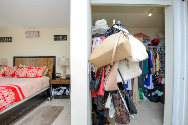 a bed room with a bed and a lamp