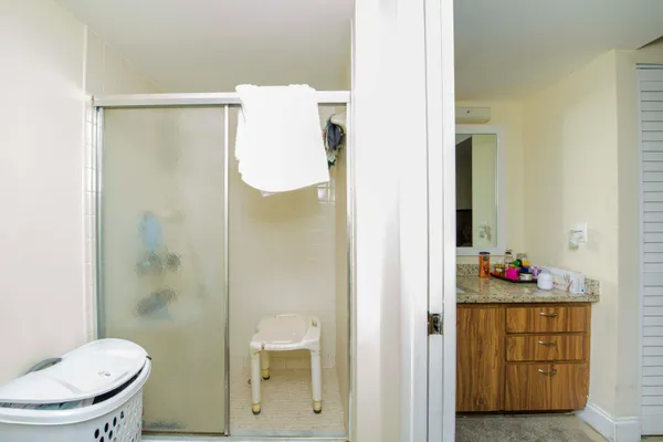 a bathroom with a toilet and a shower