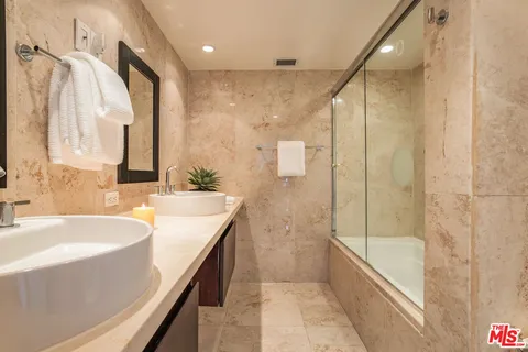 a bathroom with a bathtub and a sink