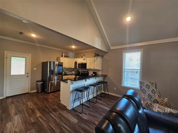 a room with furniture and a wooden floor