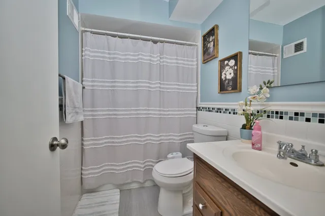 a bedroom with a bed and flat screen tv