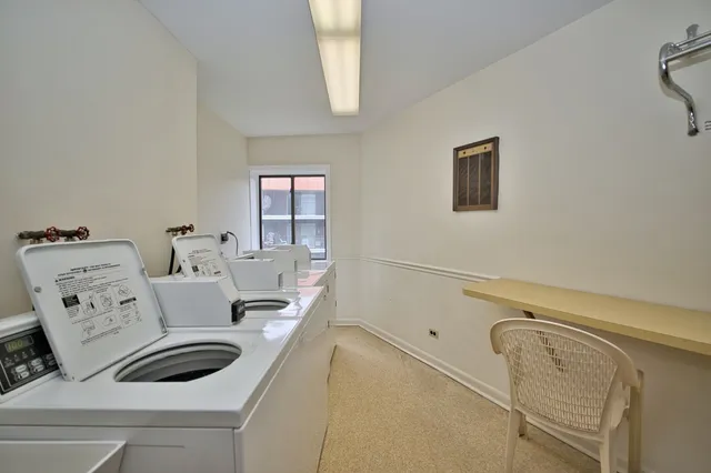 a view of a workspace with furniture