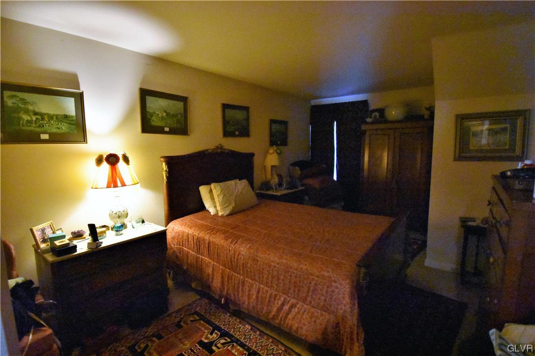 1039 Stone Stack Drive Bethlehem, PA 18015 - Photo 21 of 35 a bedroom with a bed and wooden floor