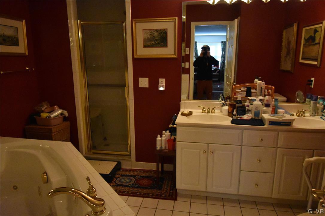 1039 Stone Stack Drive Bethlehem, PA 18015 - Photo 24 of 35 a bathroom with a sink and a mirror