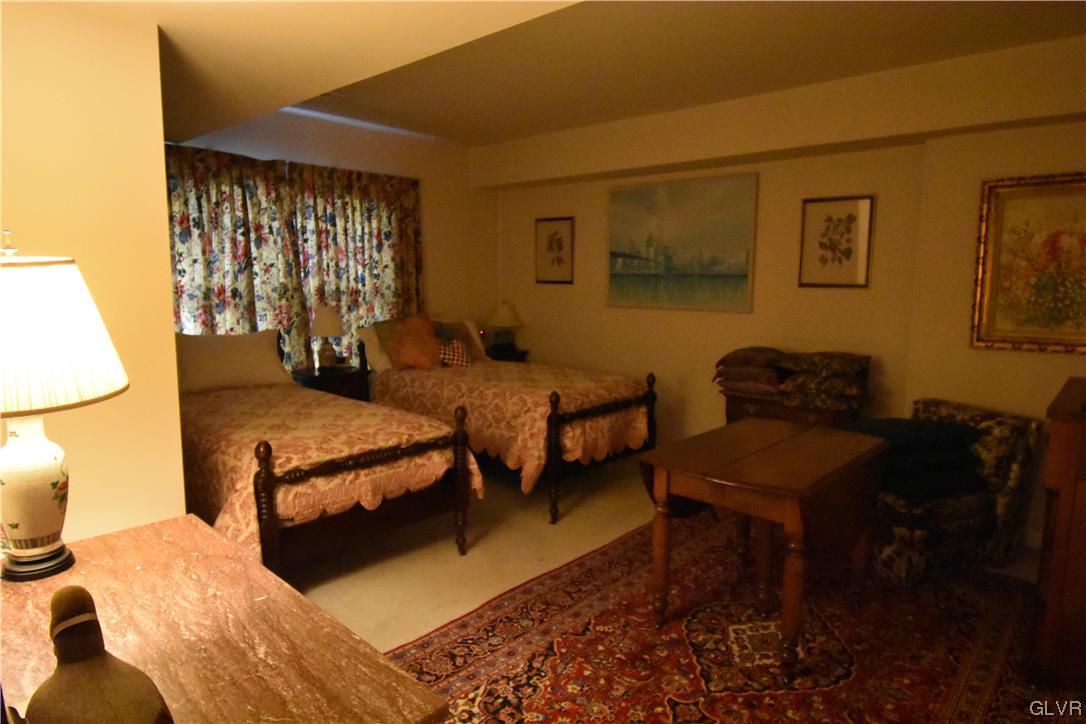 1039 Stone Stack Drive Bethlehem, PA 18015 - Photo 30 of 35 a bedroom with a bed and wooden floor