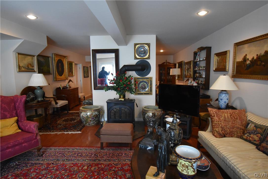 1039 Stone Stack Drive Bethlehem, PA 18015 - Photo 32 of 35 a living room filled with furniture and a flat screen tv