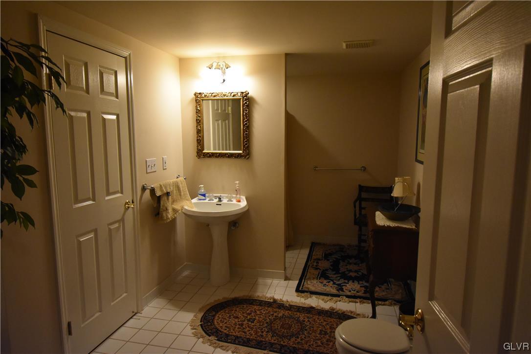 1039 Stone Stack Drive Bethlehem, PA 18015 - Photo 33 of 35 a bathroom with a sink toilet and shower