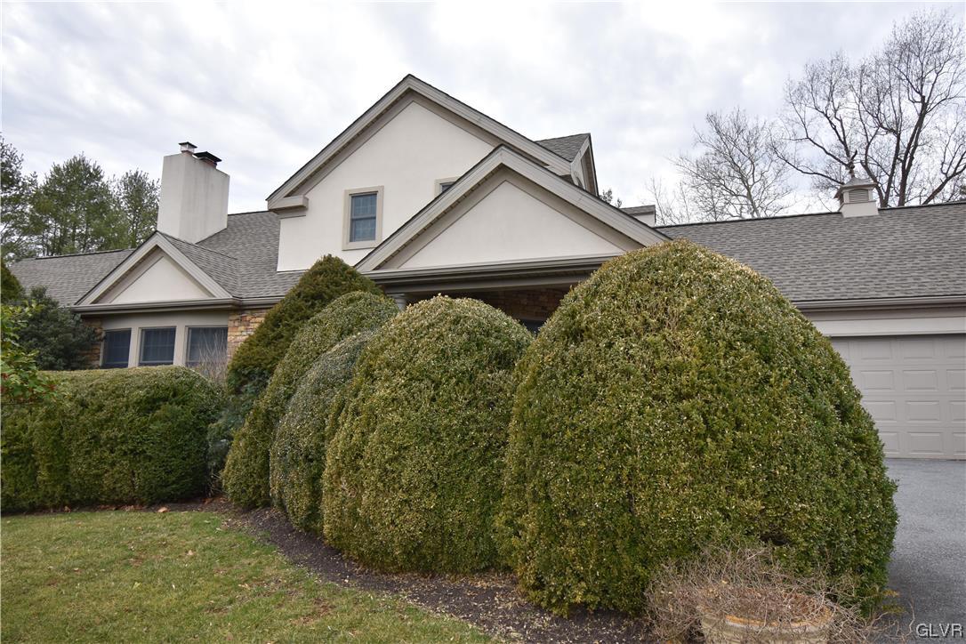 1039 Stone Stack Drive Bethlehem, PA 18015 - Photo 4 of 35 a front view of a house with a garden