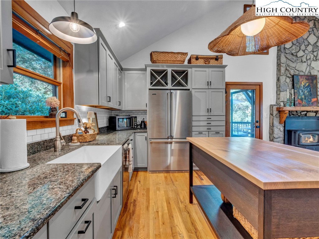 165-201 All Hallows Road Boone, NC 28607 - Photo 14 of 46 a kitchen with stainless steel appliances granite countertop a sink and a refrigerator