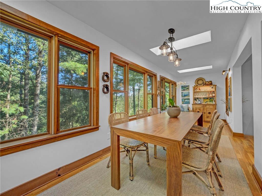 165-201 All Hallows Road Boone, NC 28607 - Photo 16 of 46 a view of a dining room with furniture window and outside view