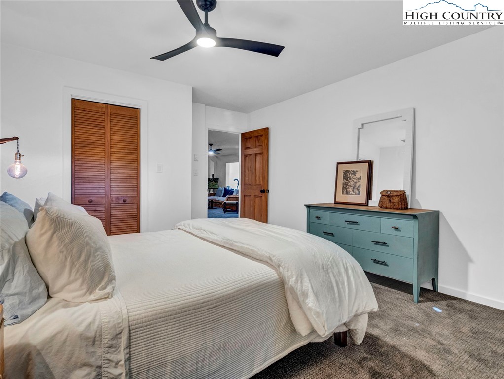 165-201 All Hallows Road Boone, NC 28607 - Photo 28 of 46 a bedroom with a bed and a dresser
