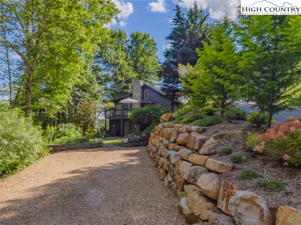 165-201 All Hallows Road Boone, NC 28607 - Photo 3 of 46 a view of a house with a tree and plants
