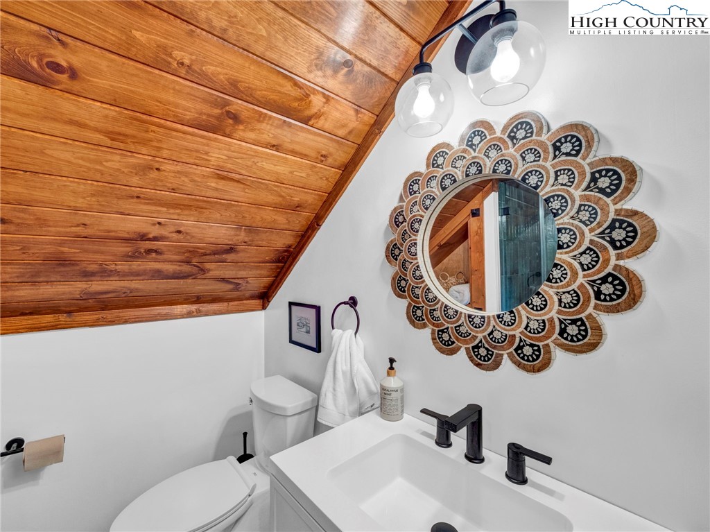 165-201 All Hallows Road Boone, NC 28607 - Photo 44 of 46 a bathroom with a toilet and a sink