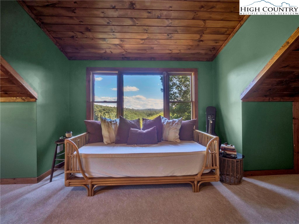 165-201 All Hallows Road Boone, NC 28607 - Photo 45 of 46 a bedroom with a bed and large windows