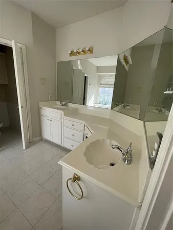 a bathroom with a sink and mirror