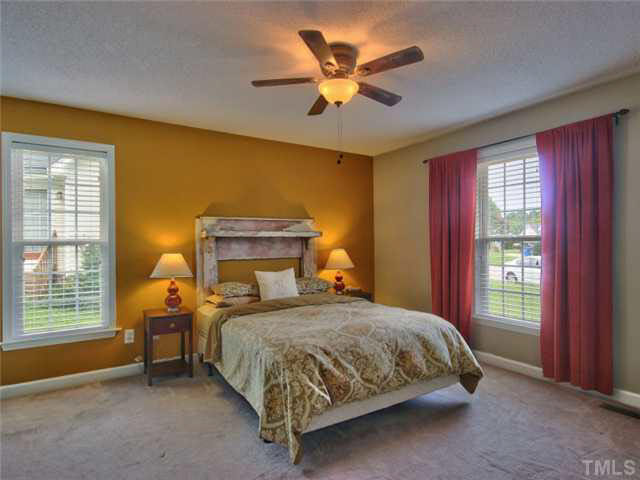 4309 Pillory Place Raleigh, NC 27616 - Photo 11 of 23 a bedroom with a bed and a window