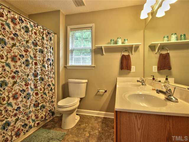 4309 Pillory Place Raleigh, NC 27616 - Photo 13 of 23 a bathroom with a sink toilet and shower