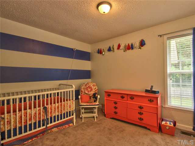 4309 Pillory Place Raleigh, NC 27616 - Photo 15 of 23 a bedroom with furniture and a window