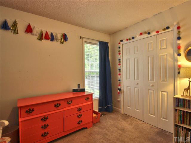4309 Pillory Place Raleigh, NC 27616 - Photo 16 of 23 a view of a closet in a bedroom