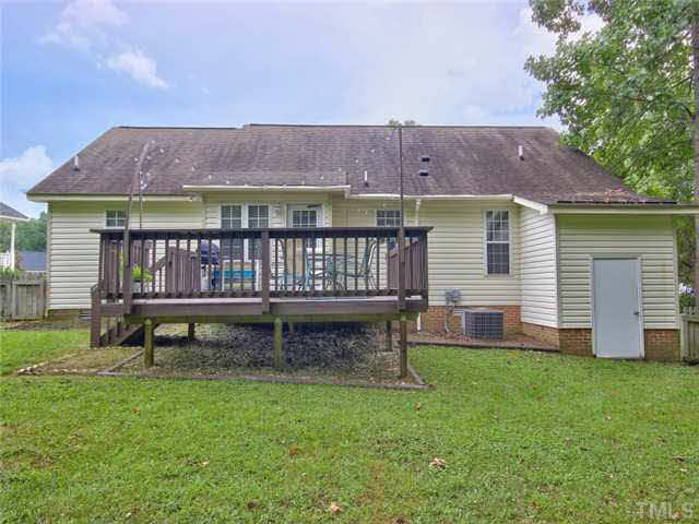 4309 Pillory Place Raleigh, NC 27616 - Photo 18 of 23 a view of a house with a yard and deck
