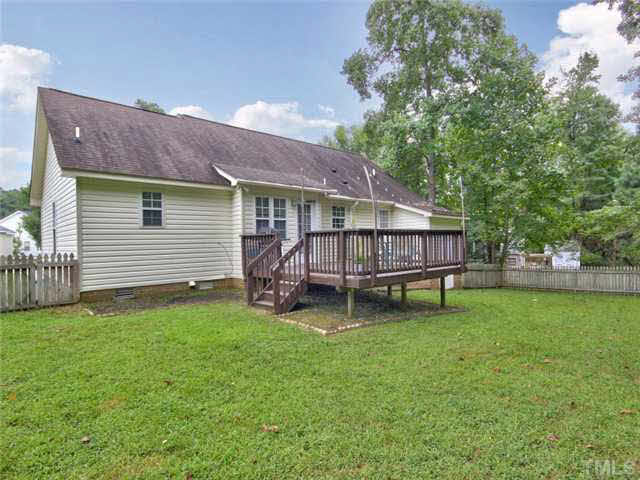 4309 Pillory Place Raleigh, NC 27616 - Photo 19 of 23 a backyard of a house with table and chairs