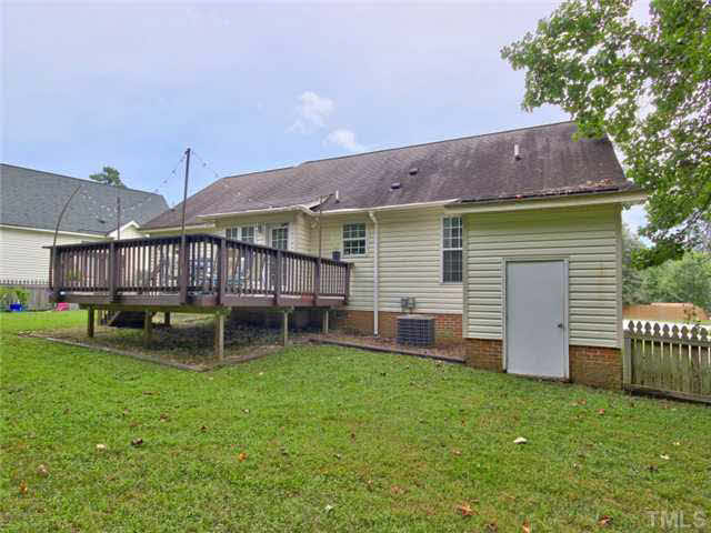 4309 Pillory Place Raleigh, NC 27616 - Photo 20 of 23 a backyard of a house with table and sofas