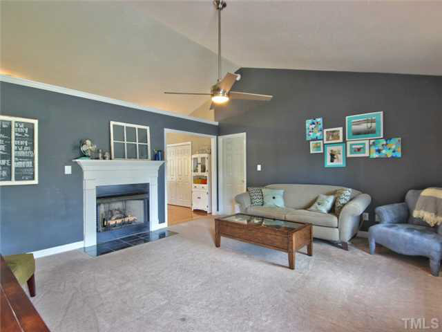4309 Pillory Place Raleigh, NC 27616 - Photo 3 of 23 a living room with furniture and a fireplace
