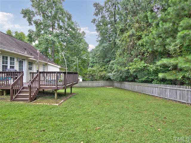 4309 Pillory Place Raleigh, NC 27616 - Photo 22 of 23 a view of a house with backyard and a hammock
