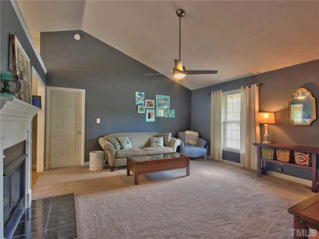 4309 Pillory Place Raleigh, NC 27616 - Photo 4 of 23 a living room with furniture and a fireplace