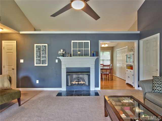 4309 Pillory Place Raleigh, NC 27616 - Photo 5 of 23 a living room with furniture and a fireplace