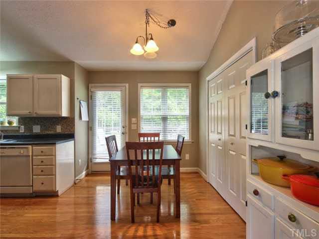 4309 Pillory Place Raleigh, NC 27616 - Photo 9 of 23 a view of a dining room with furniture window and wooden floor