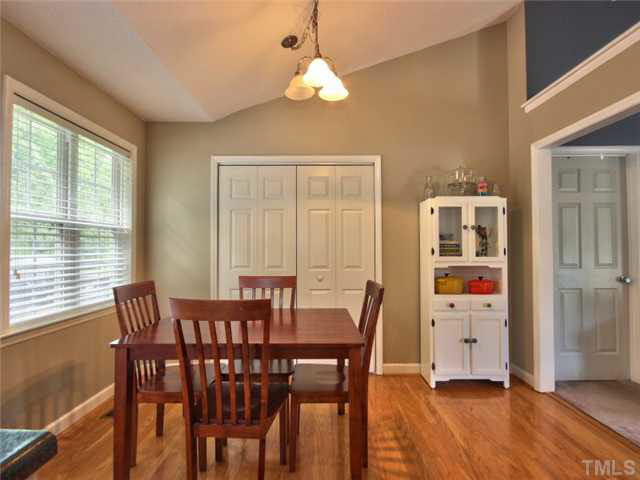 4309 Pillory Place Raleigh, NC 27616 - Photo 10 of 23 a view of a dining room with furniture window and wooden floor