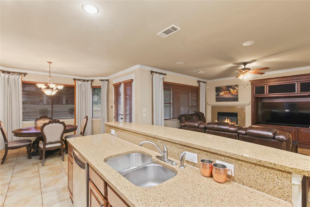 9116 Perimeter Street Denton, TX 76207 - Photo 15 of 26 a bathroom with a sink and a large mirror