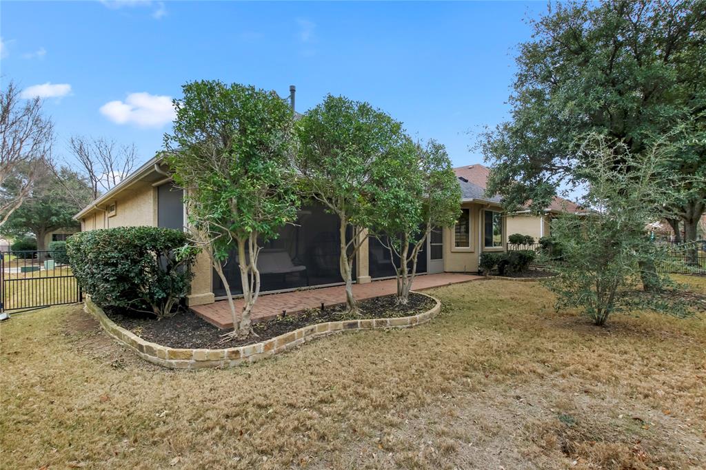 9116 Perimeter Street Denton, TX 76207 - Photo 24 of 26 a view of a house with backyard and trees