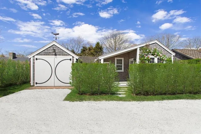 a house view with a garden space