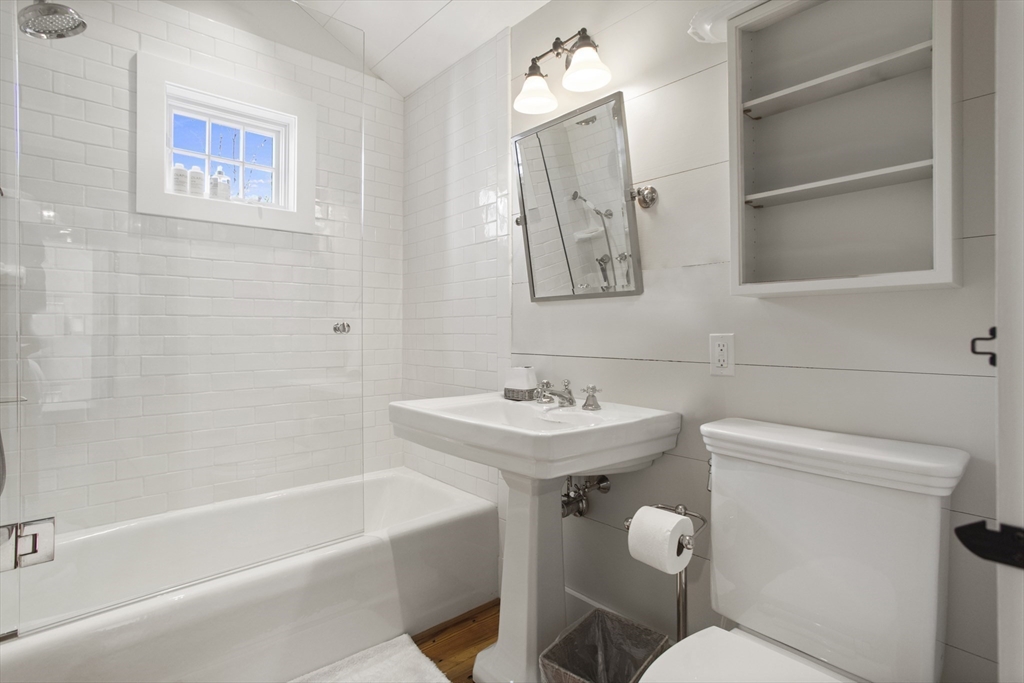 9 Lily Street Nantucket, MA 02554 - Photo 14 of 17 a bathroom with a toilet sink and mirror