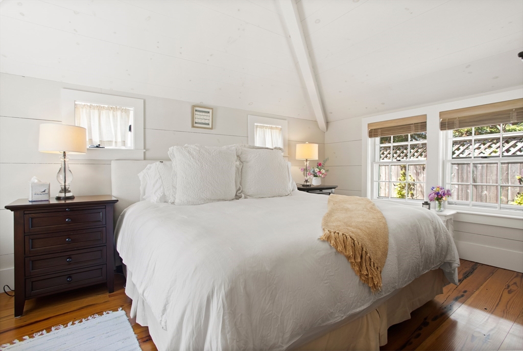 9 Lily Street Nantucket, MA 02554 - Photo 15 of 17 a bed room with a bed window and a night stand