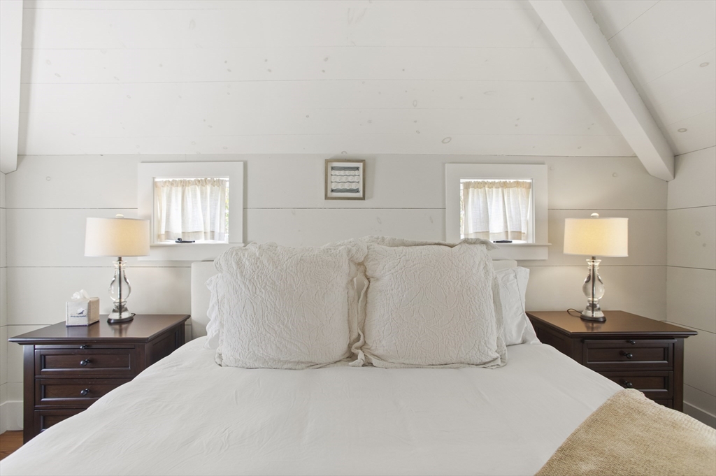 9 Lily Street Nantucket, MA 02554 - Photo 16 of 17 a large white bed in a white room