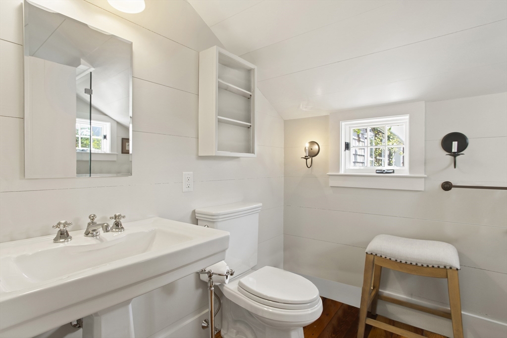 9 Lily Street Nantucket, MA 02554 - Photo 17 of 17 a bathroom with a sink toilet and a mirror