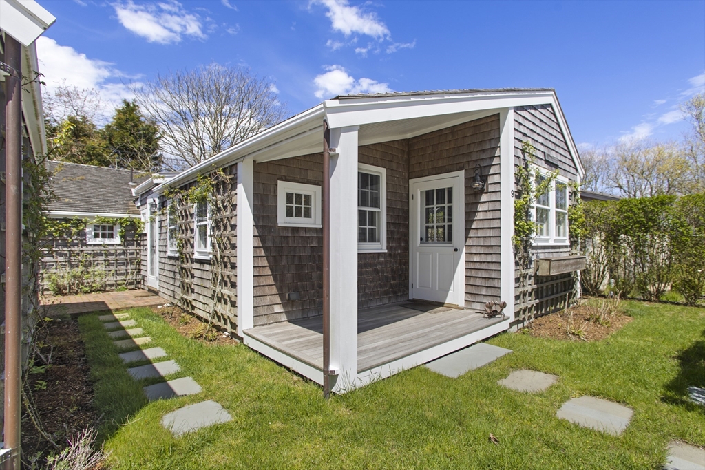 9 Lily Street Nantucket, MA 02554 - Photo 4 of 17 a view of a house with backyard and porch