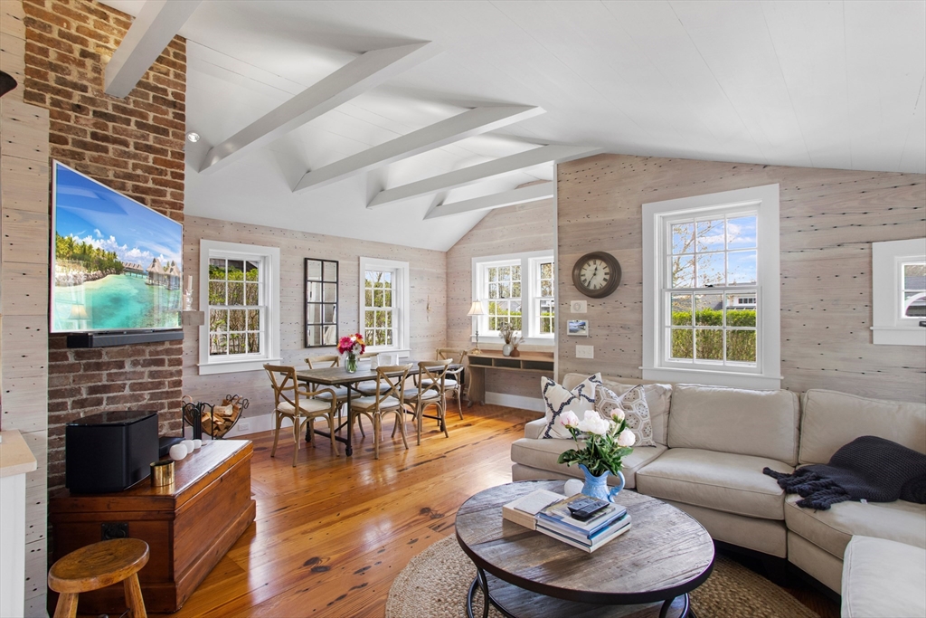 9 Lily Street Nantucket, MA 02554 - Photo 7 of 17 a living room with fireplace furniture and a large window