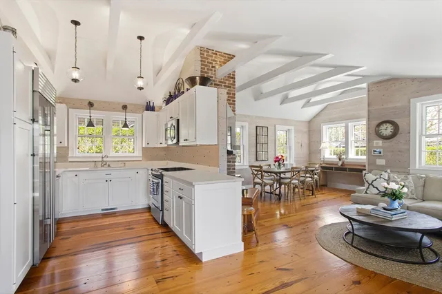 a open kitchen with sink cabinets and wooden floor