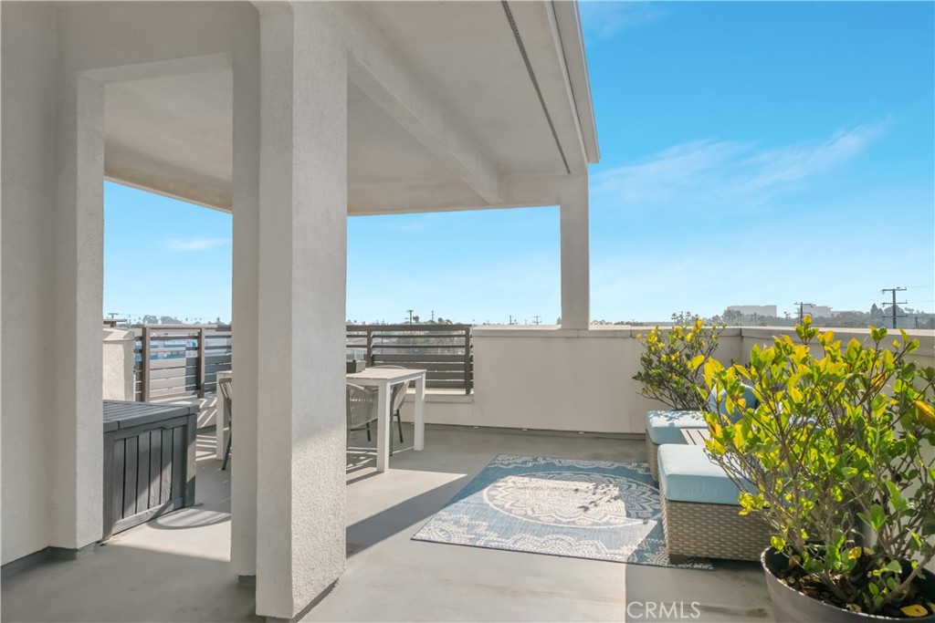 637 Cardiff Reef Costa Mesa, CA 92627 - Photo 24 of 27 a view of a terrace with lawn chairs
