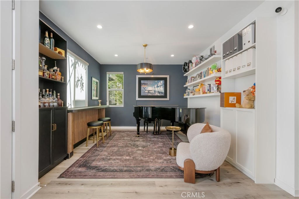 637 Cardiff Reef Costa Mesa, CA 92627 - Photo 4 of 27 a living room with furniture and paintings on the wall
