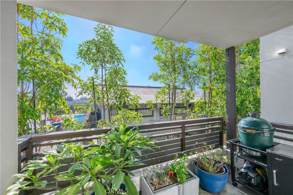 637 Cardiff Reef Costa Mesa, CA 92627 - Photo 8 of 27 a view of a porch with furniture and a potted plant