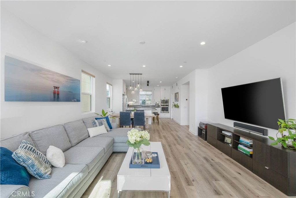 637 Cardiff Reef Costa Mesa, CA 92627 - Photo 10 of 27 a living room with furniture and a flat screen tv