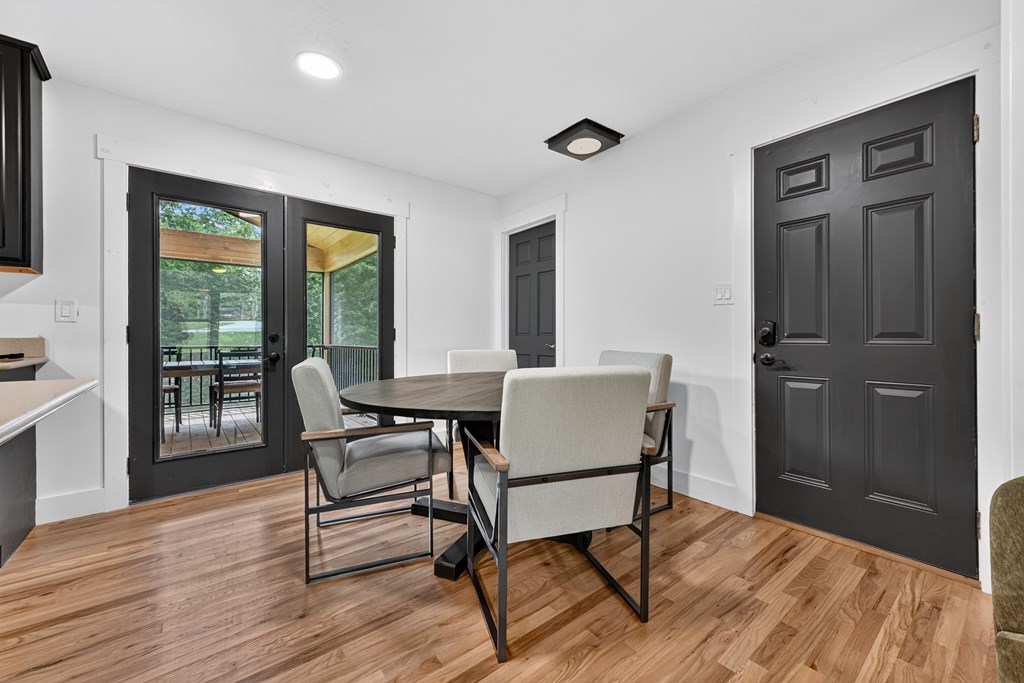 975 Goss Road Epworth, GA 30541 - Photo 46 of 58 a view of a dining room with furniture and wooden floor