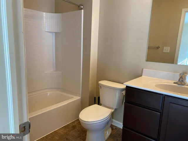 a bathroom with a sink toilet and bathtub